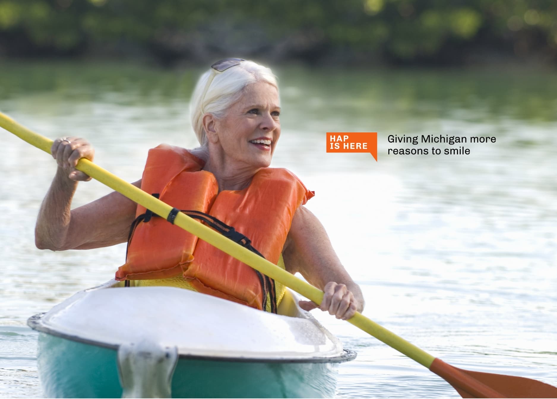 a senior woman enjoying herself while kayaking